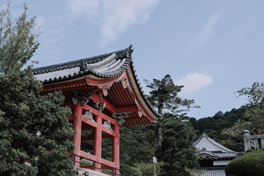 Scenic view of a traditional pagoda surrounded by trees in Kyoto, Japan.